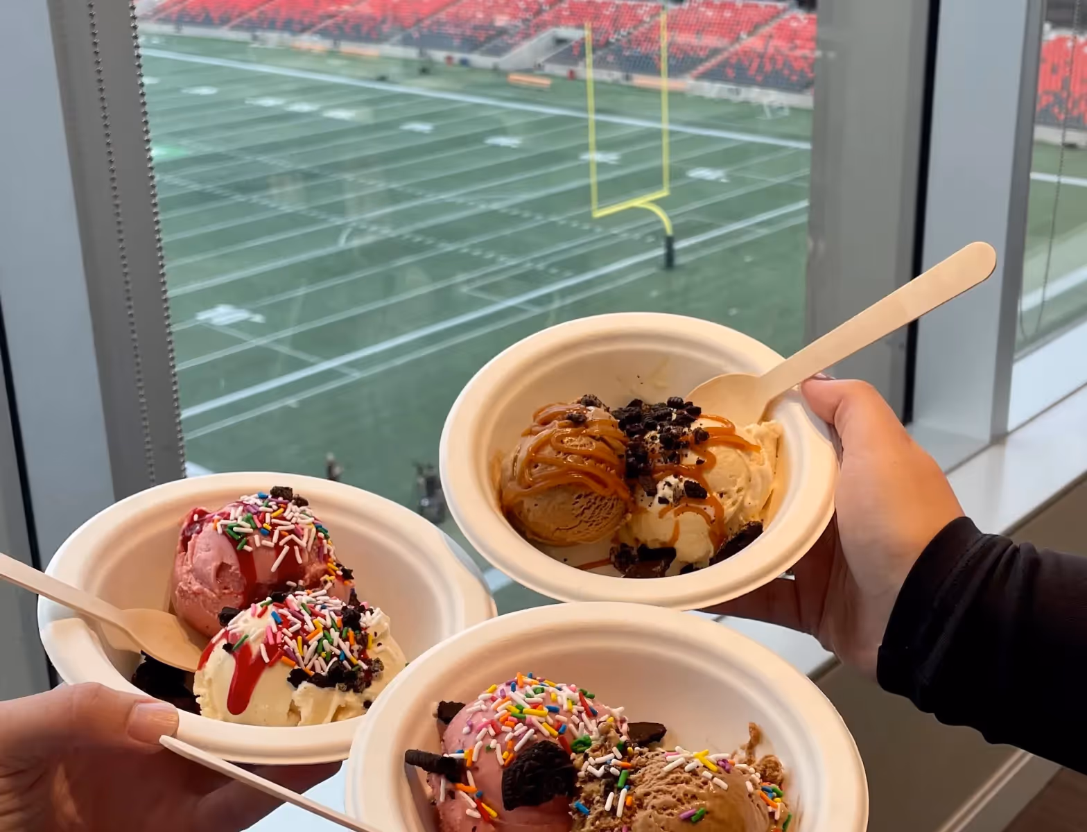 Noibu team eating ice cream on a football game