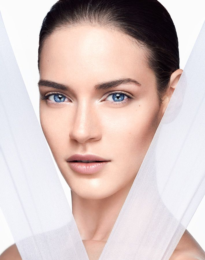 A woman with flawless, radiant skin after a plasma pen treatment. The close-up highlights the smoothness and youthful appearance achieved through plasma skin tightening and plasma lift procedures.