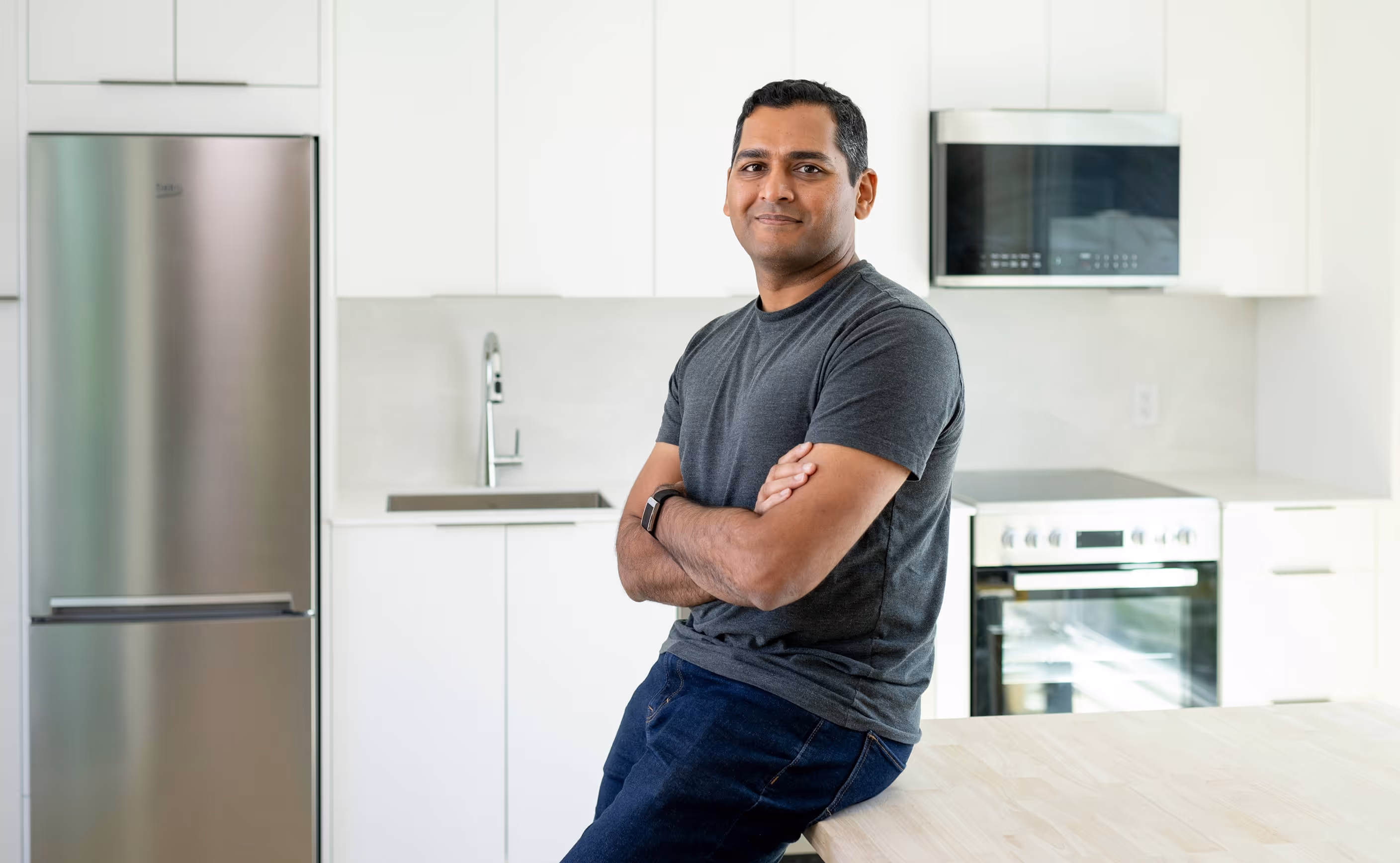 Reframe Systems CEO Vikas Enti in the kitchen of a modular home