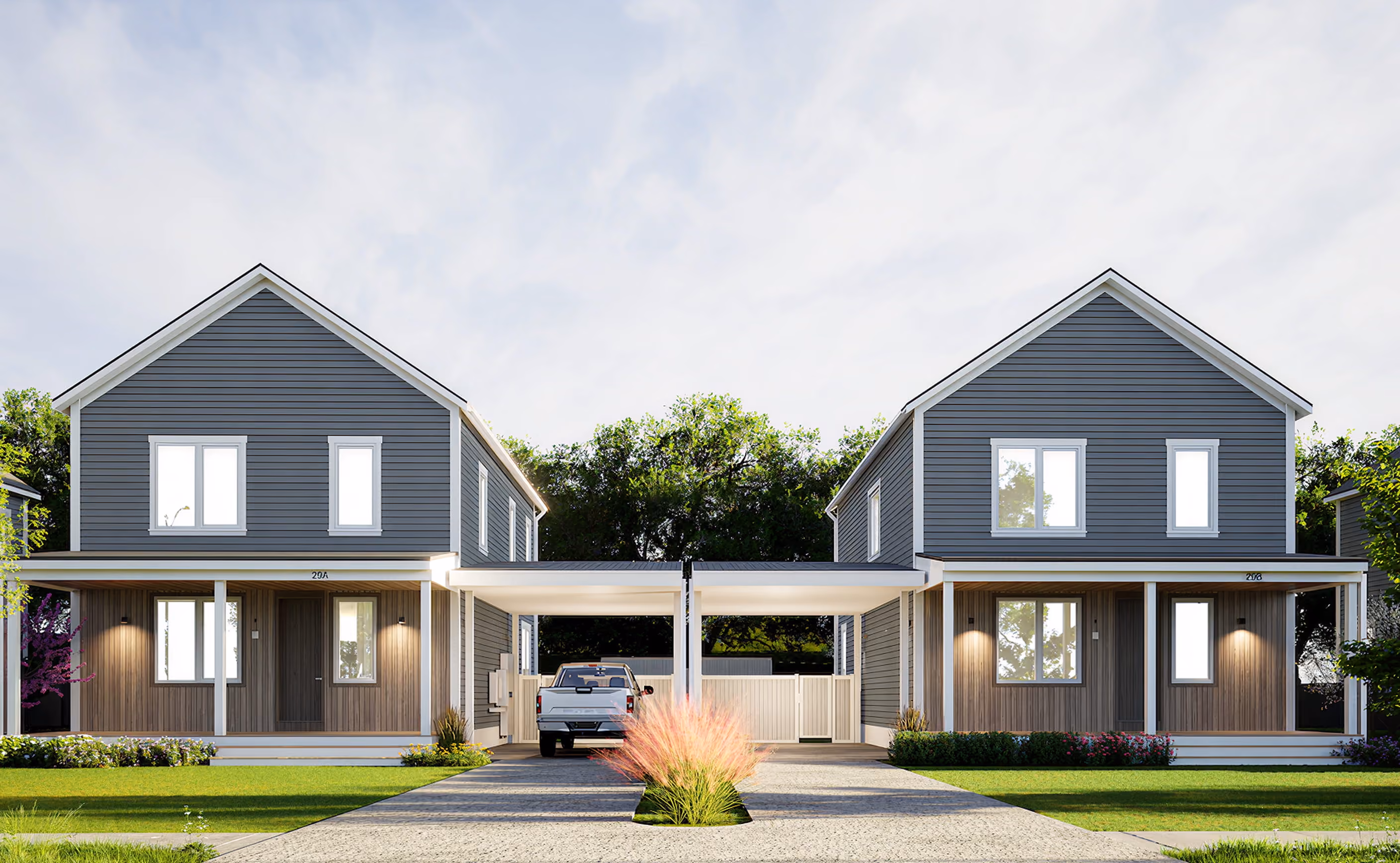 Front rendering of two dark-gray Adams Circle homes with covered porches, landscaped lawns, and a shared central walkway.