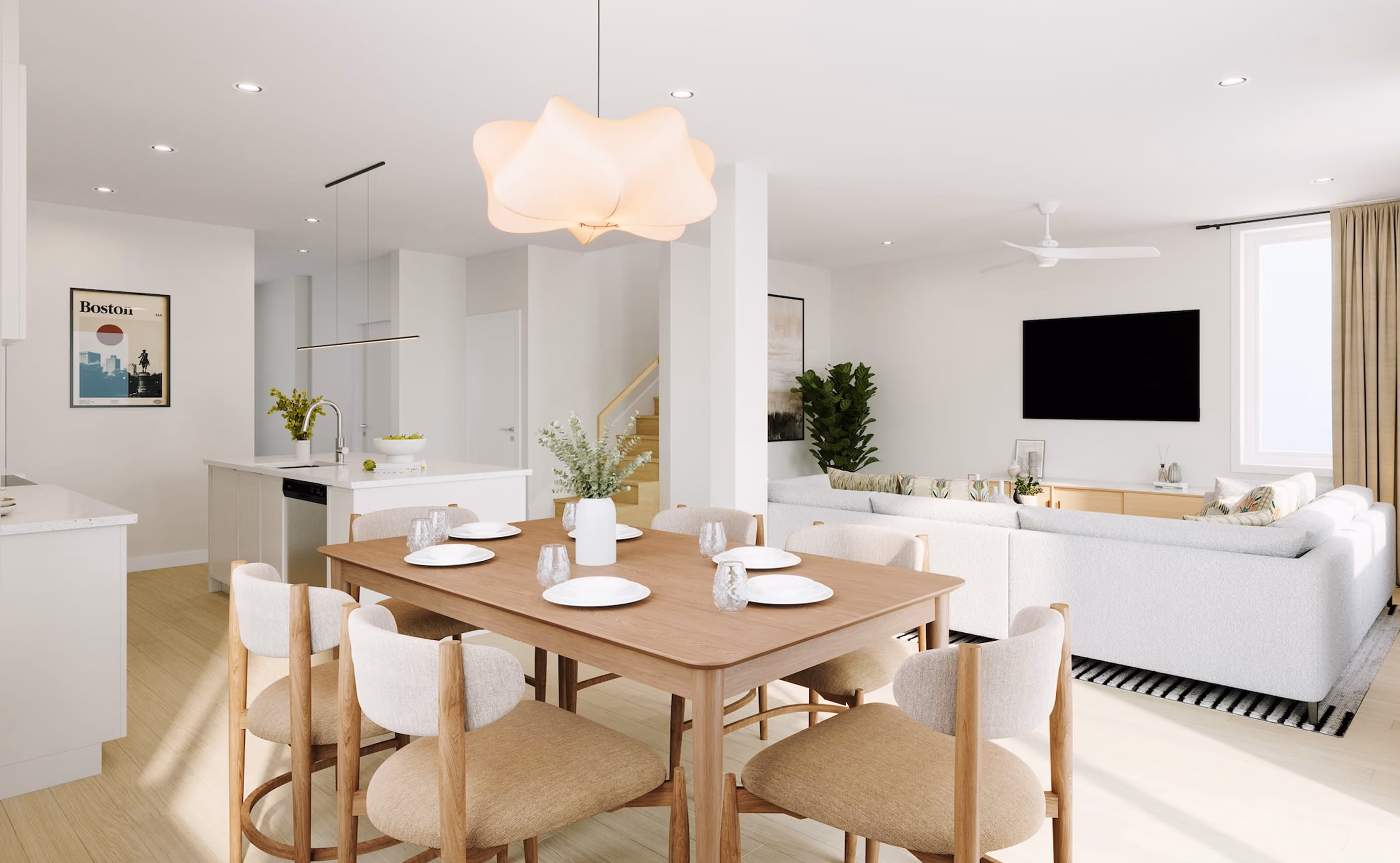 Open dining and living area with a wood table, white chairs, pendant lighting, and a wall-mounted television.