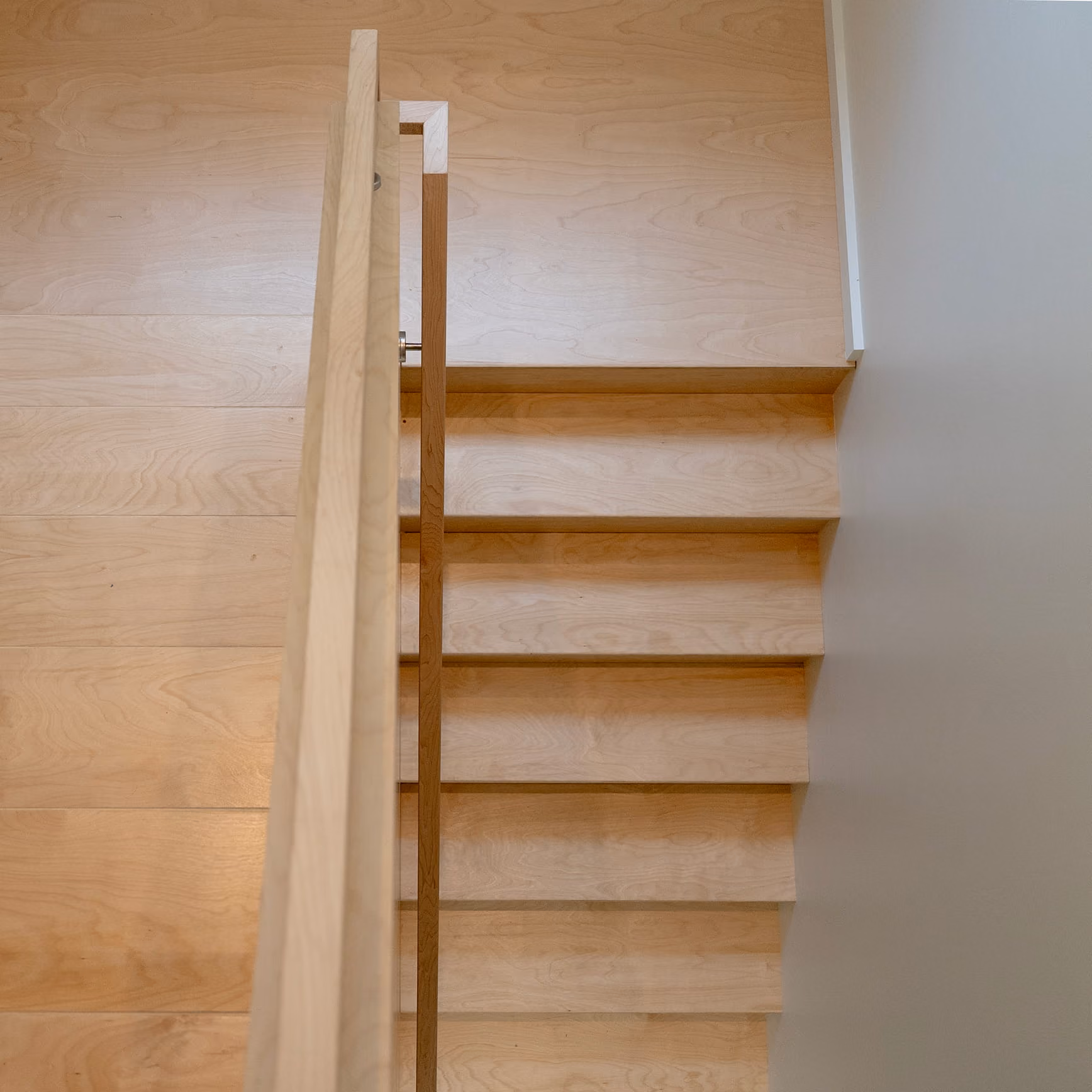 Wooden staircase detail inside the Dorothy ADU