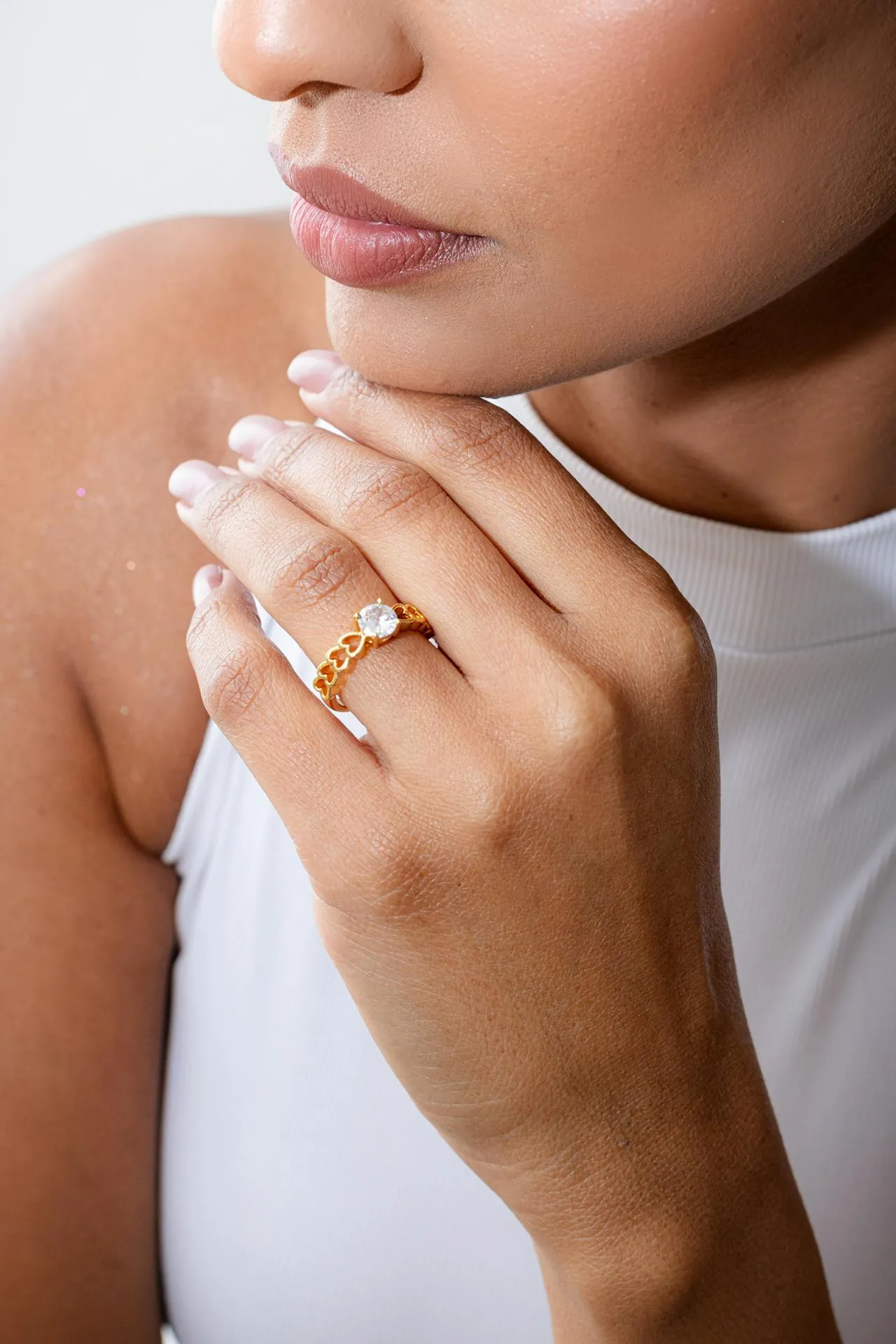 A close up of a person wearing a ring.