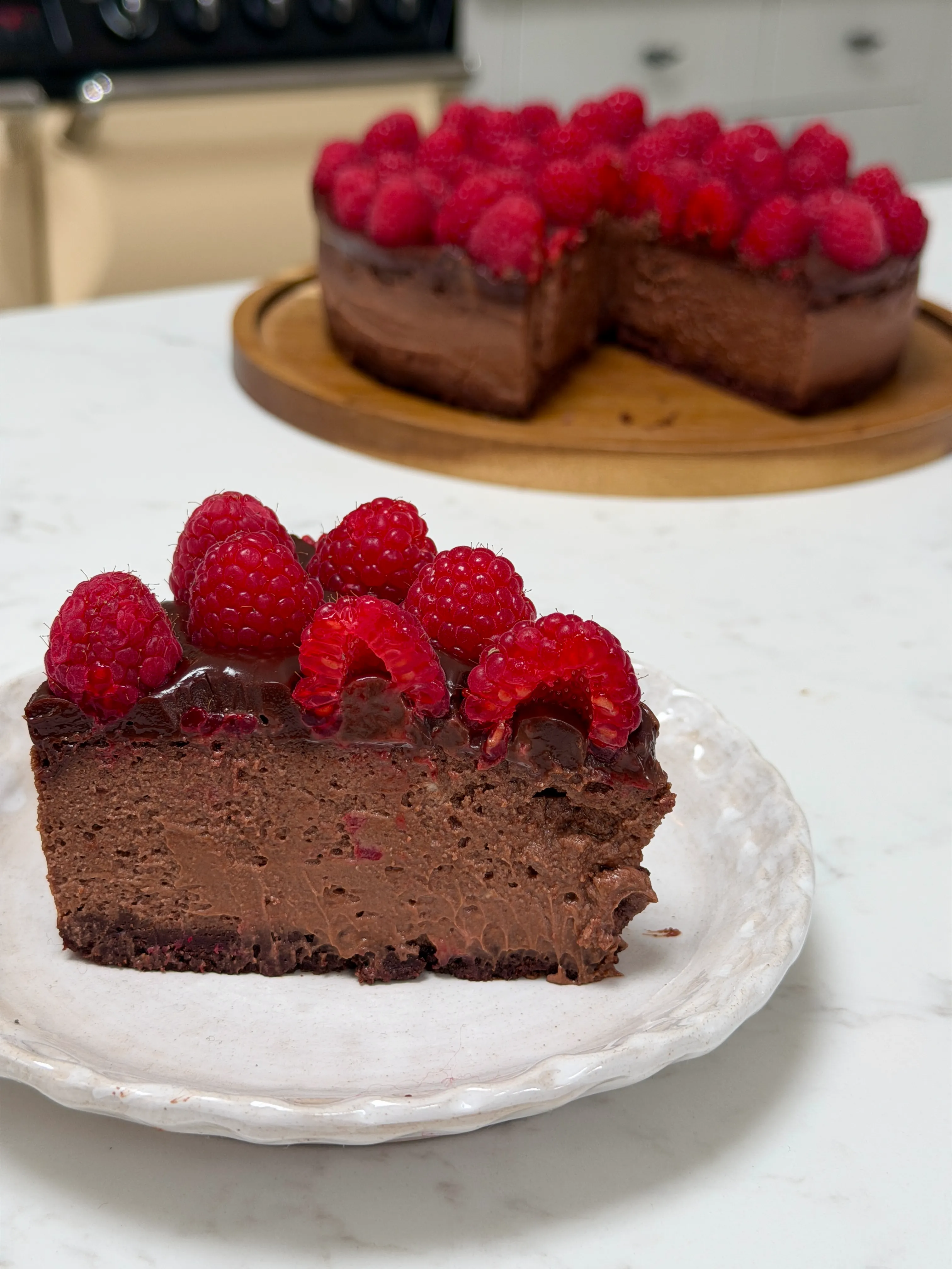 Triple Chocolate Baked Cheesecake with Raspberries