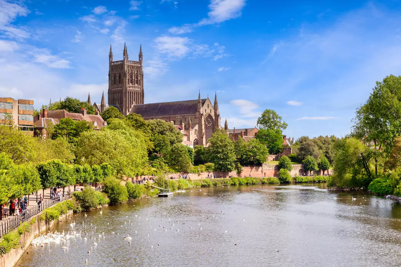 View of Worcester cathedral from river on sunny day.