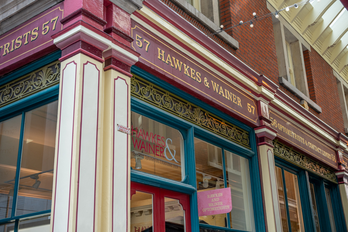 Historic Hawkes & Wainer optometrist storefront with ornate architectural details