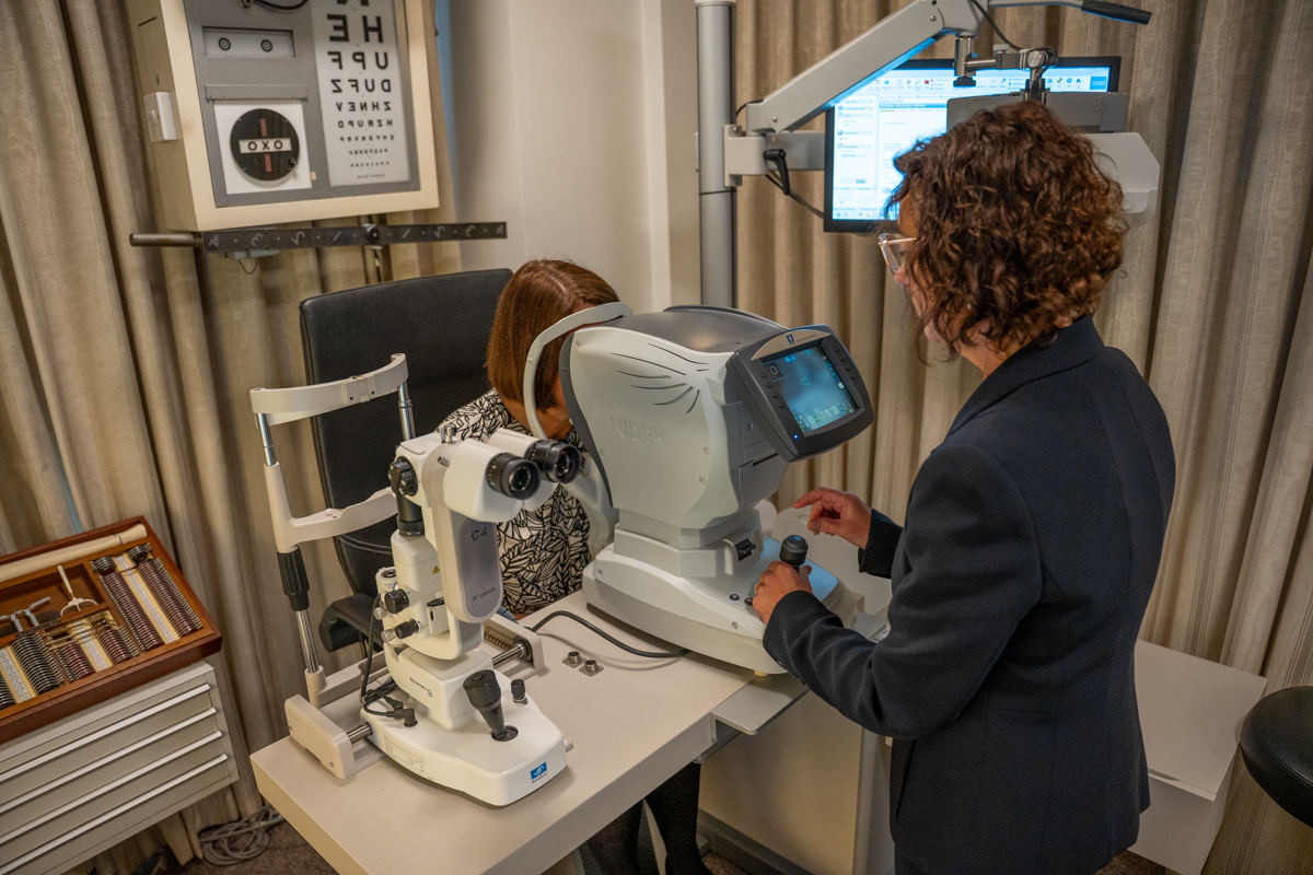 Eye examination with advanced optical equipment in clinical setting