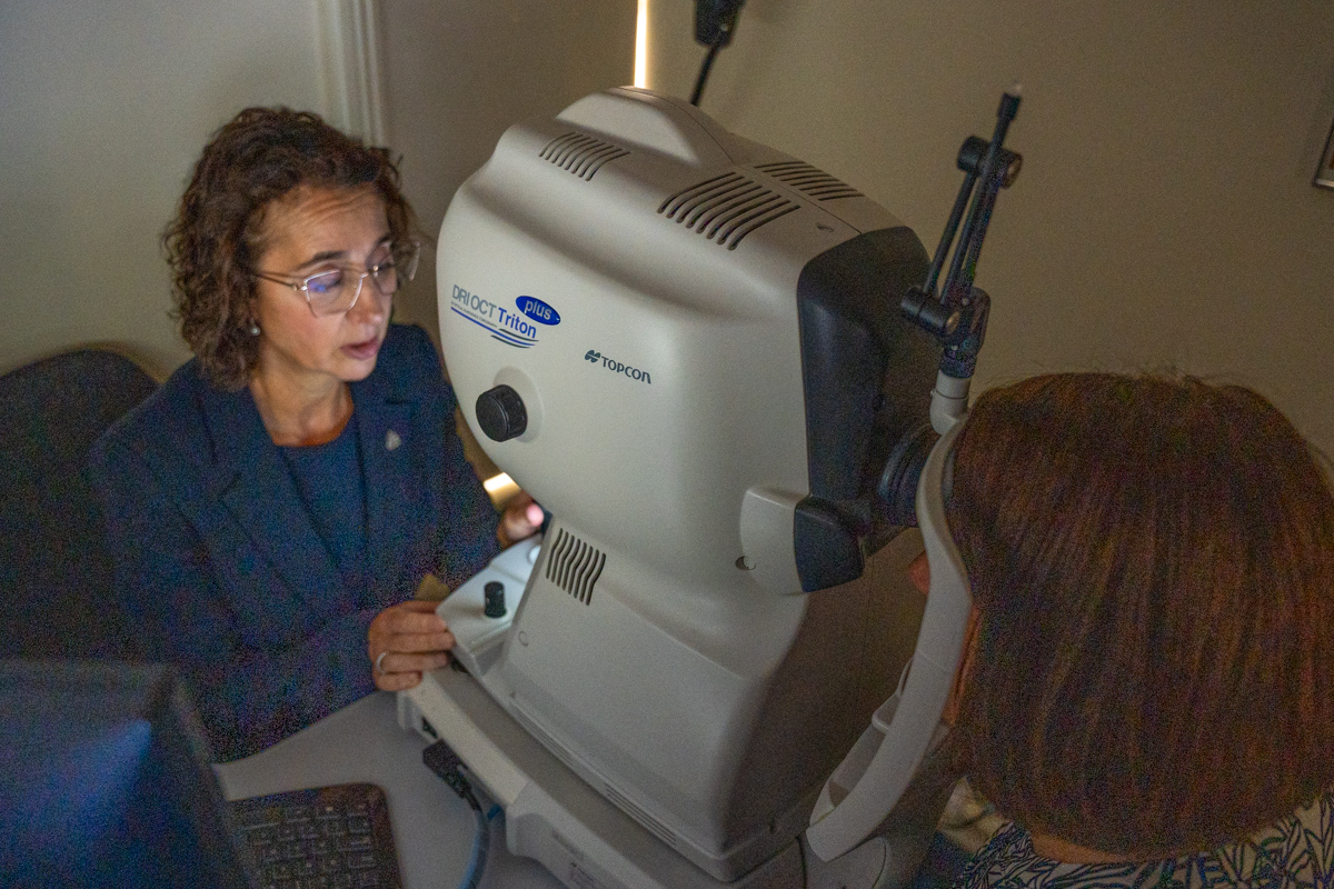 Eye doctor performs eye exam using Topcon OCT Triton medical device