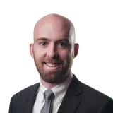 A picture of Simon, CEO of Rezco Asset Management benefitting from increased productivity with GenAI from Alis Exchange Solutions.