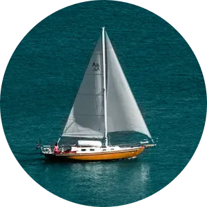 An elegant sailing yacht gliding through clear blue waters, symbolizing freedom, innovation, and the seamless journey of building applications on the Alis Exchange platform.