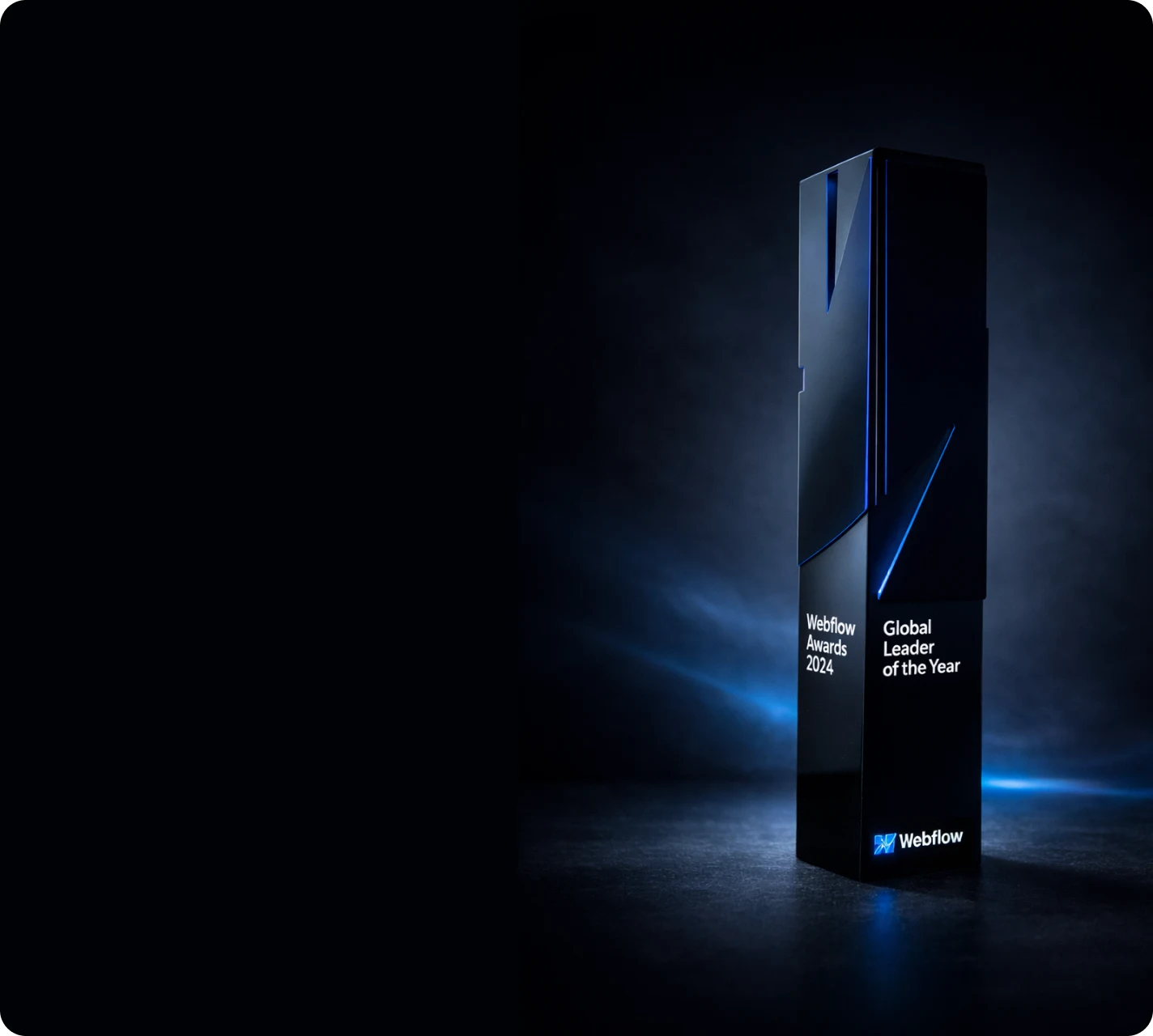 Black Webflow Awards 2024 “Global Leader of the Year” trophy photographed in a dark environment with subtle blue lighting. A premium visual emphasizing leadership, expertise, and international recognition.