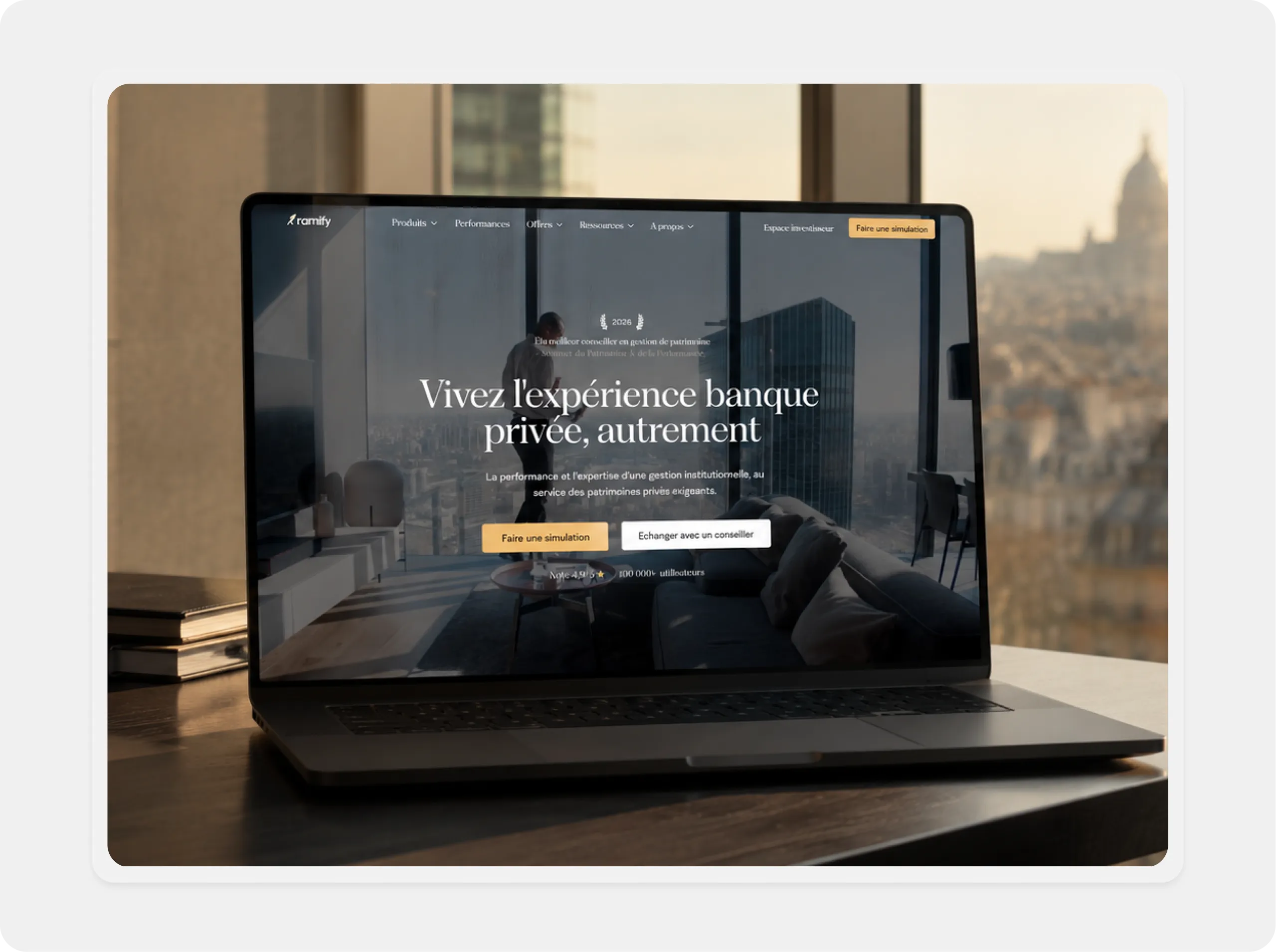 Laptop displaying a private banking website in French with cityscape in the background.