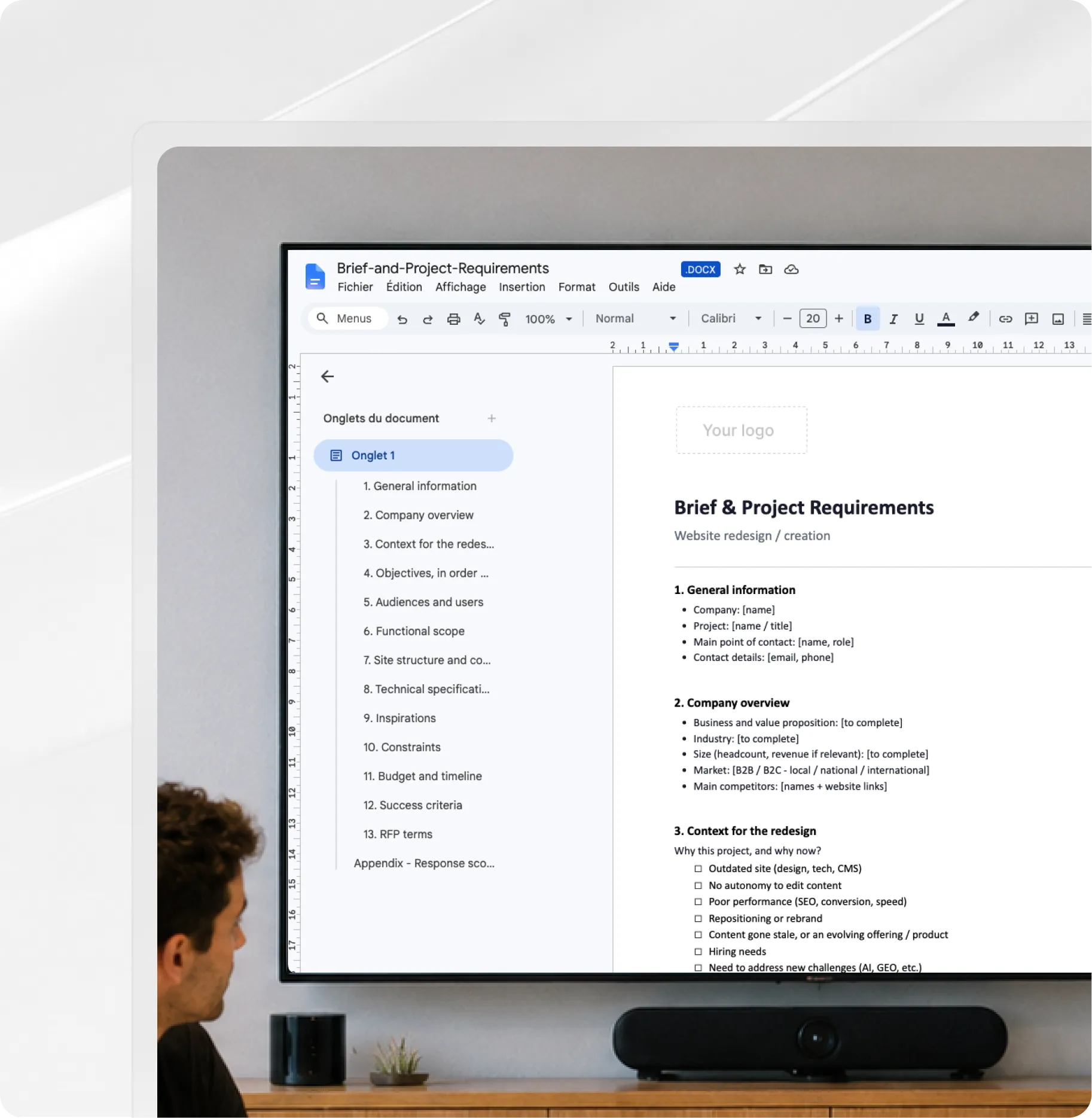 Person looking at a screen displaying a document titled 'Brief & Project Requirements' with an outline and details.