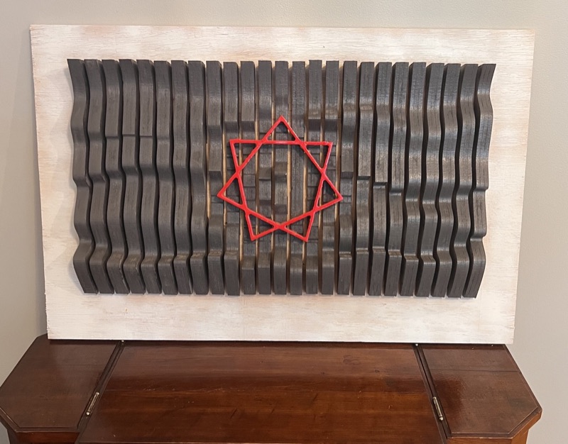 Carved wavy wall art made from slats