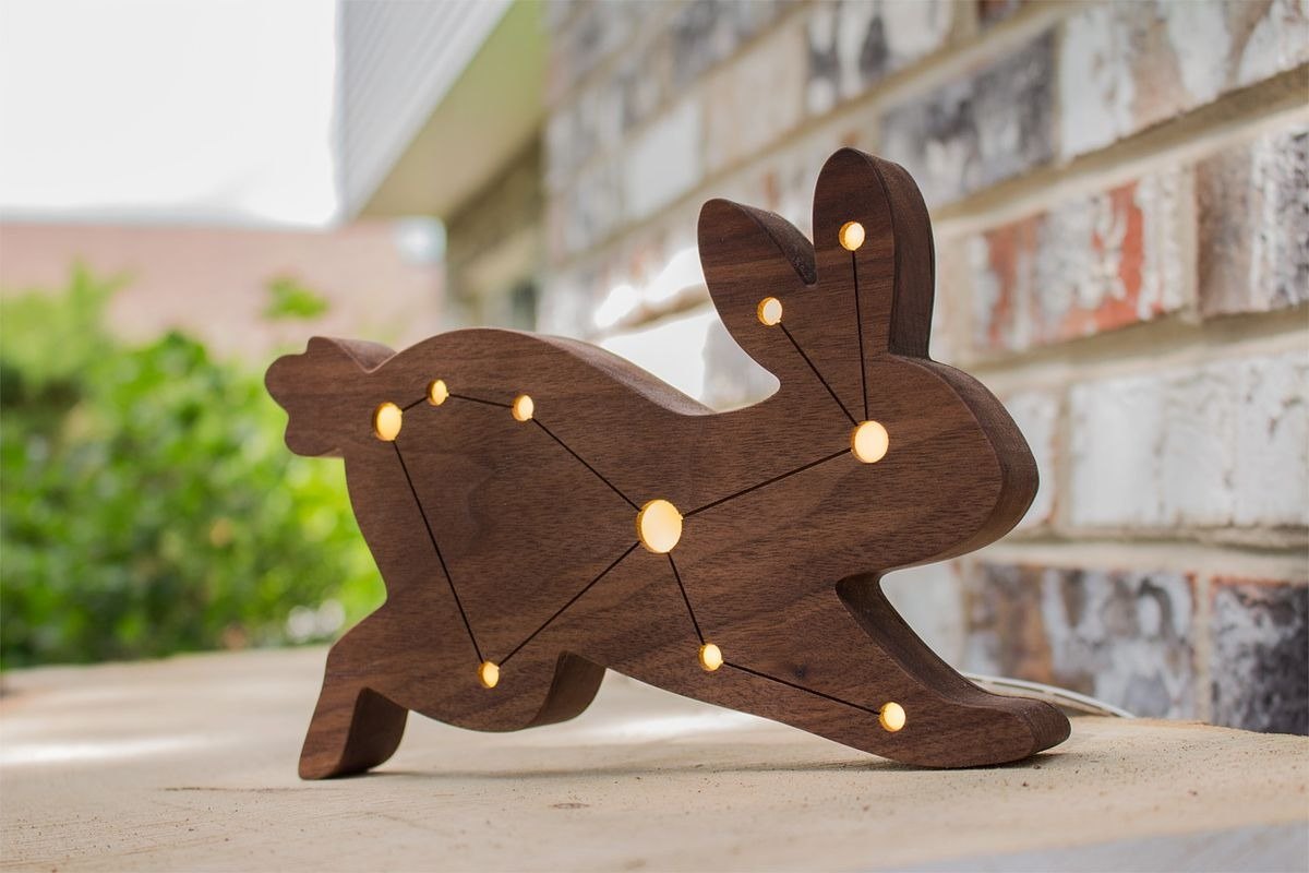 A walnut hare with the Lepus constellation picked out in small lit holes.