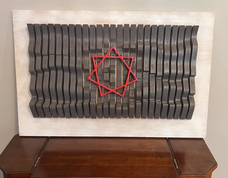 Carved wavy wall art made from slats