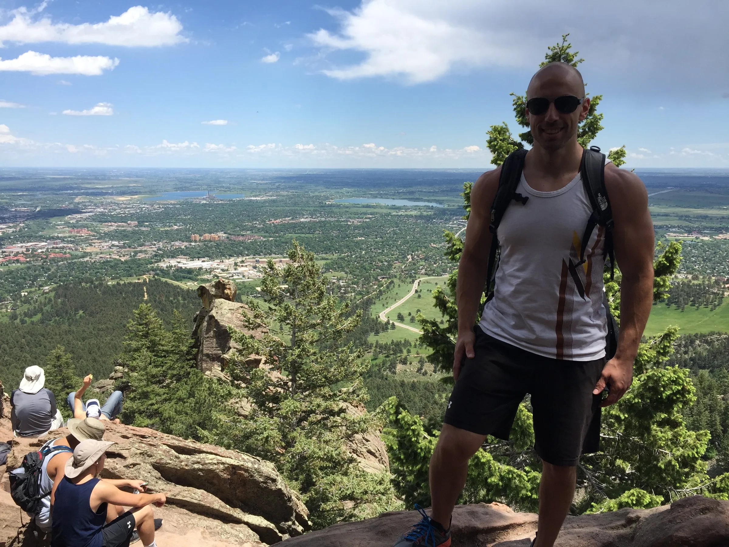 Justin on a Front Range hiking summit above the plains