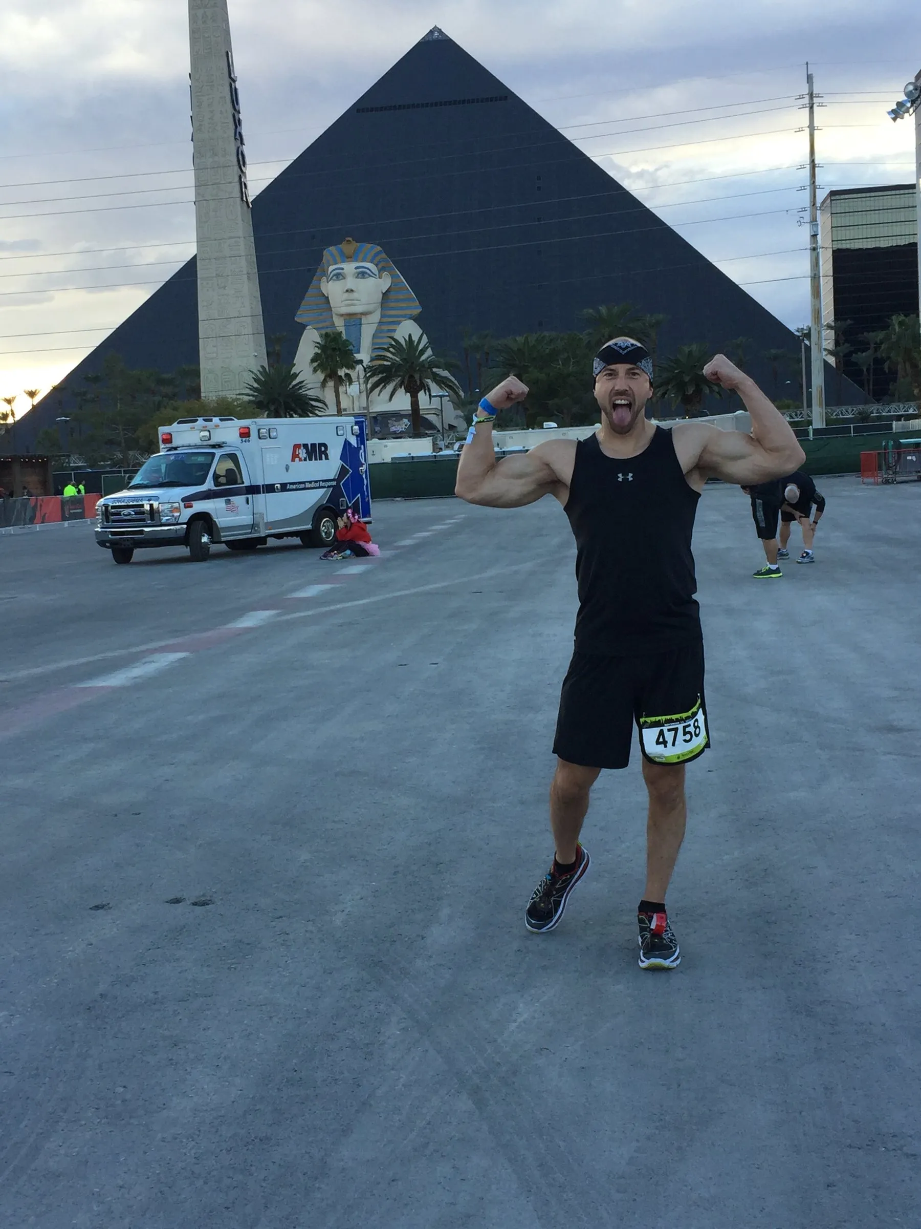 Justin flexing at a race finish line in Las Vegas