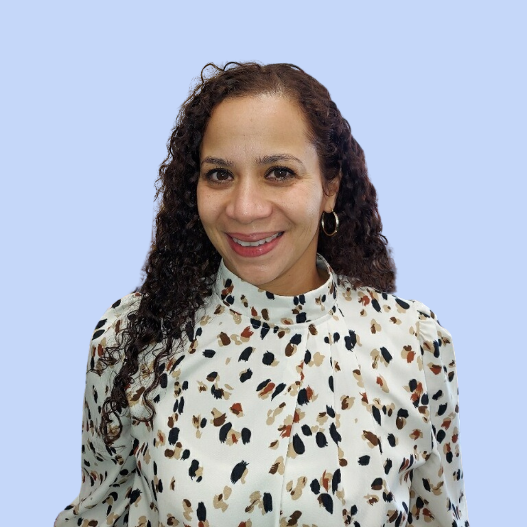 Ms. Rodriguez smiling in a professional staff headshot photo