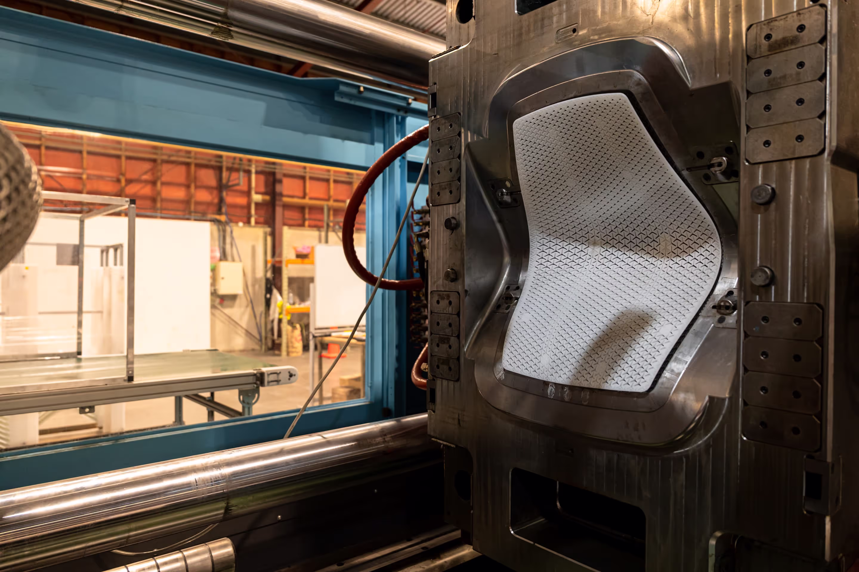 precision injection moulding machine making a Noho Move chair