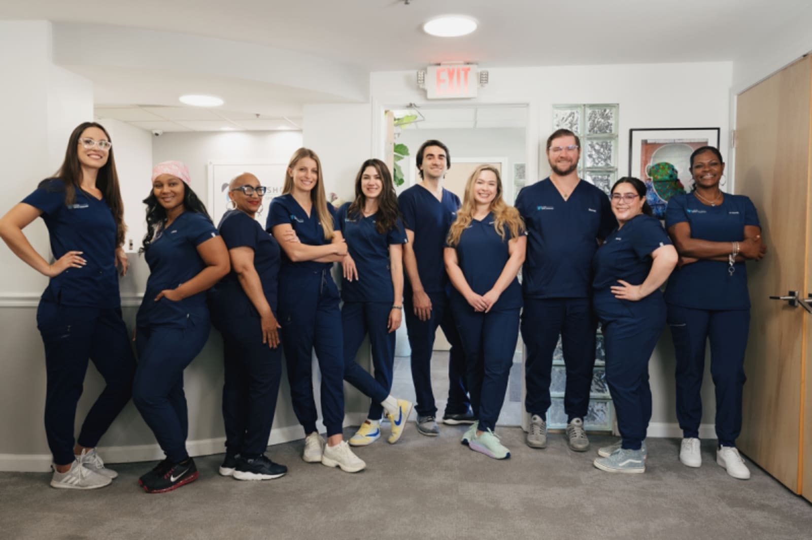 Lakeshore Dental Specialists team in scrubs standing together in office