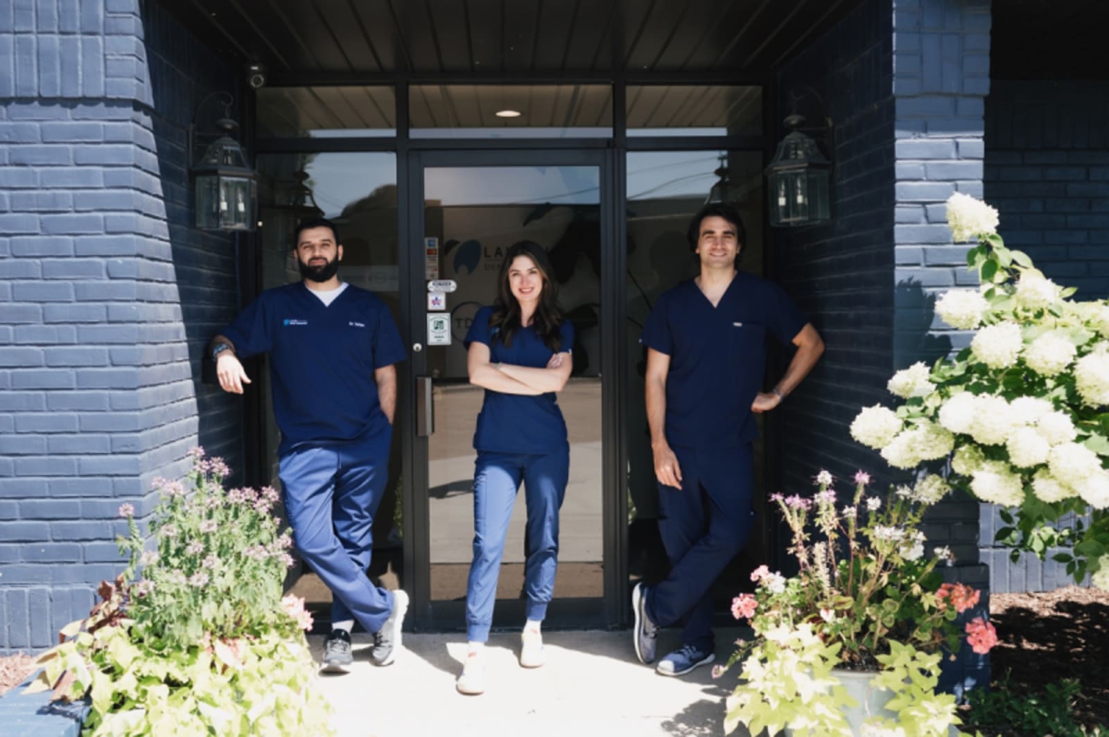 Lakeshore Dental Specialists team members standing at office entrance