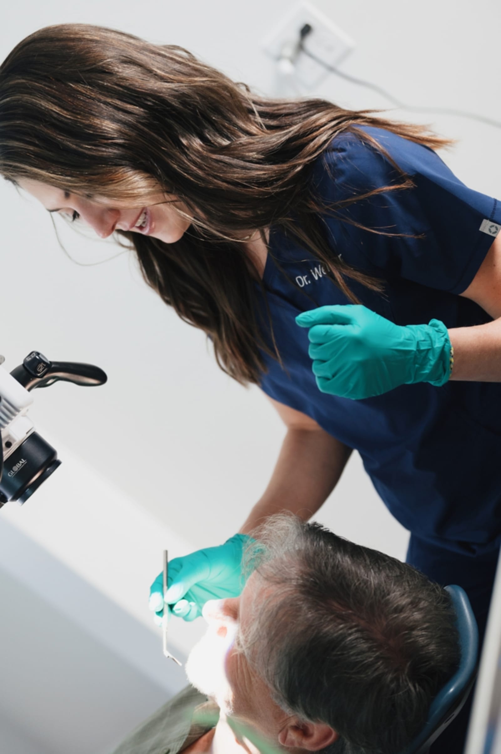 Dentist discussing treatment plan with patient in clinical setting