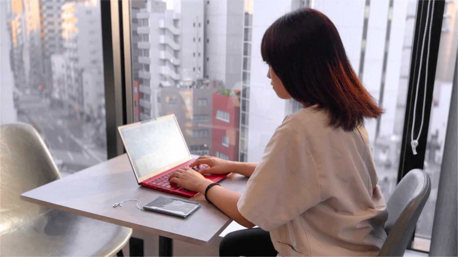 A person in an office working on their laptop.