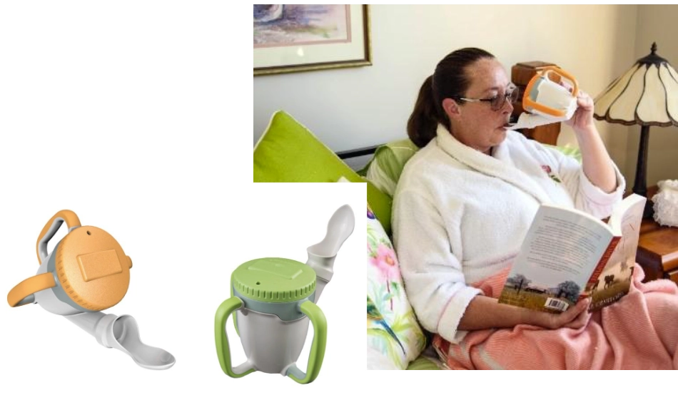 Woman reading in bed while drinking from Rosecup adaptive cup.