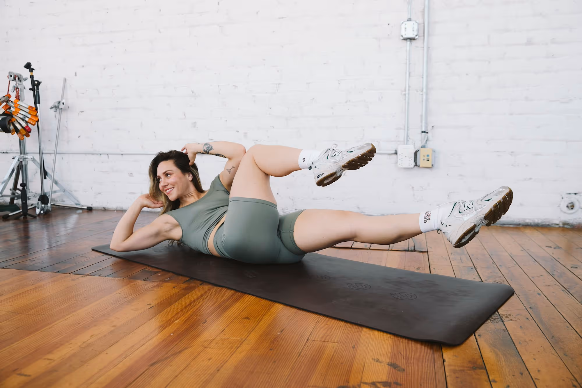A female fitness coach is demonstrating the best exercise for PCOS.