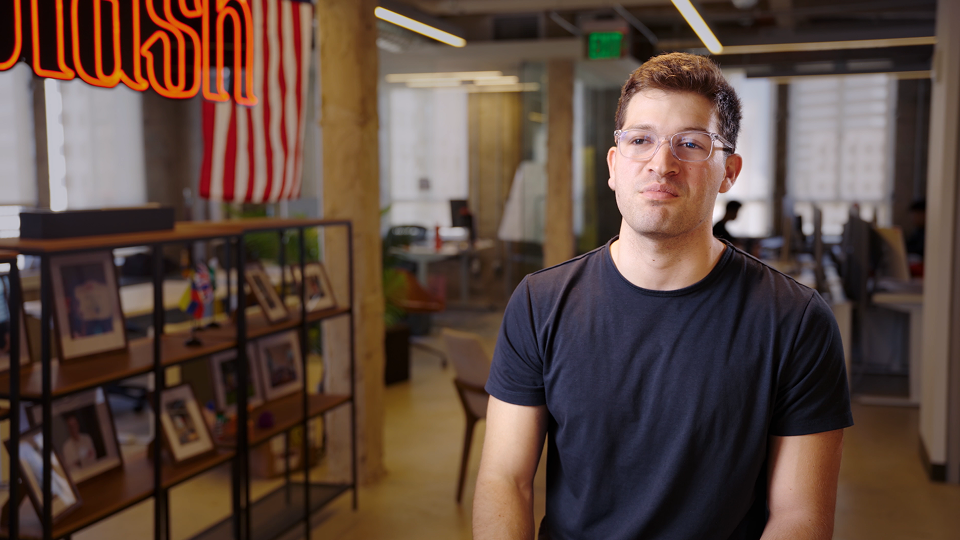 Slash founder in the office introducing his DualEntry customer story