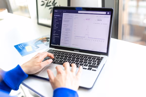 Hands typing on keyboard. Online store management board.