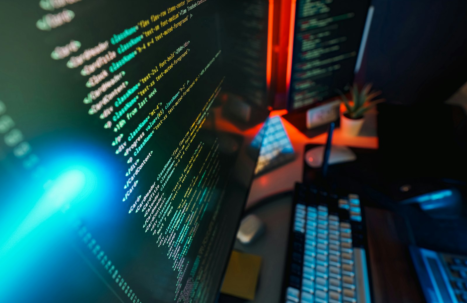 Programming code on computer screens in a developer workspace