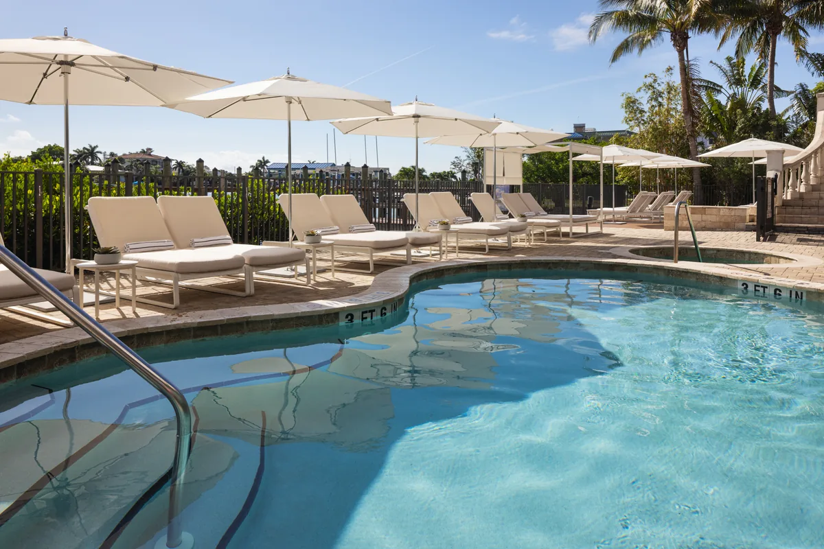 Hotel Zamora pool deck with lounge chairs and umbrellas