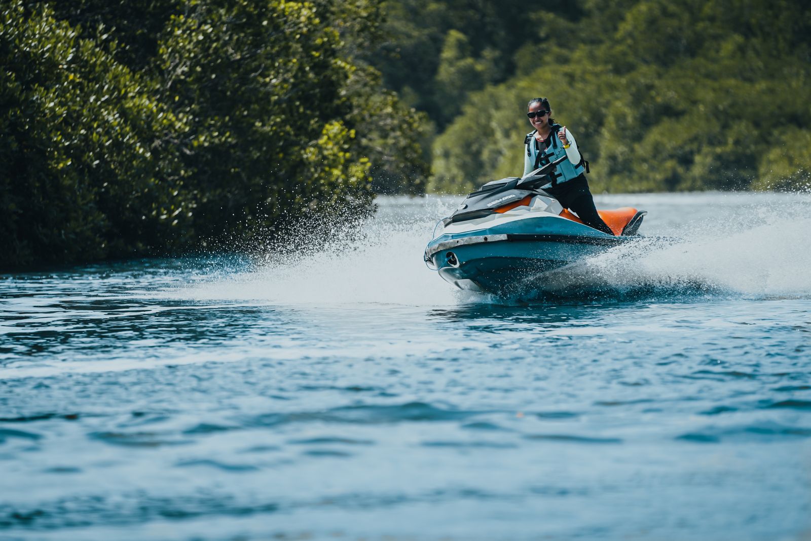 Jet ski rider on a green lake in Guatapé
