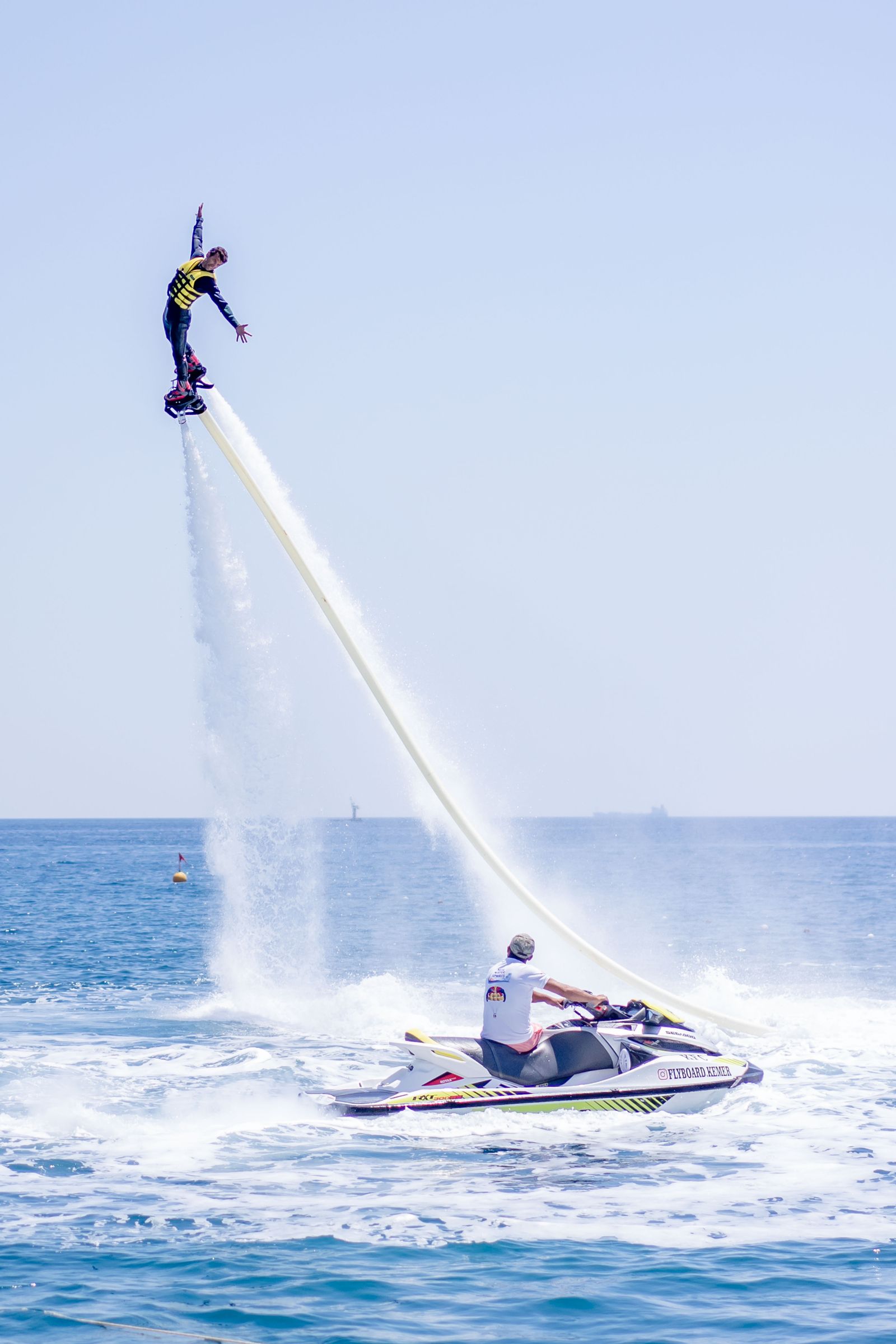 Flyboard rider hovering above the water in Guatapé