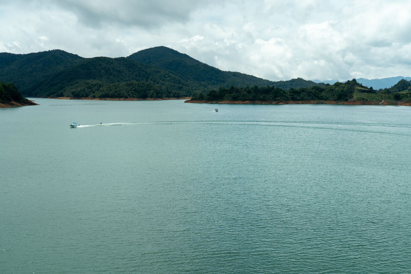 Boats crossing the Guatapé reservoir