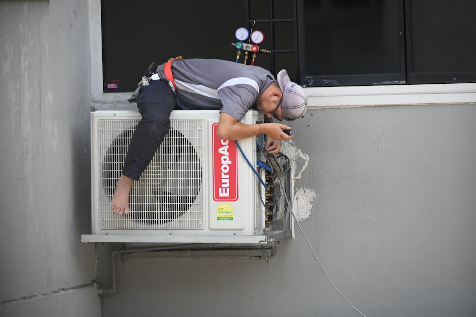 technician performing maintenance on an air conditioner - ac repair draper