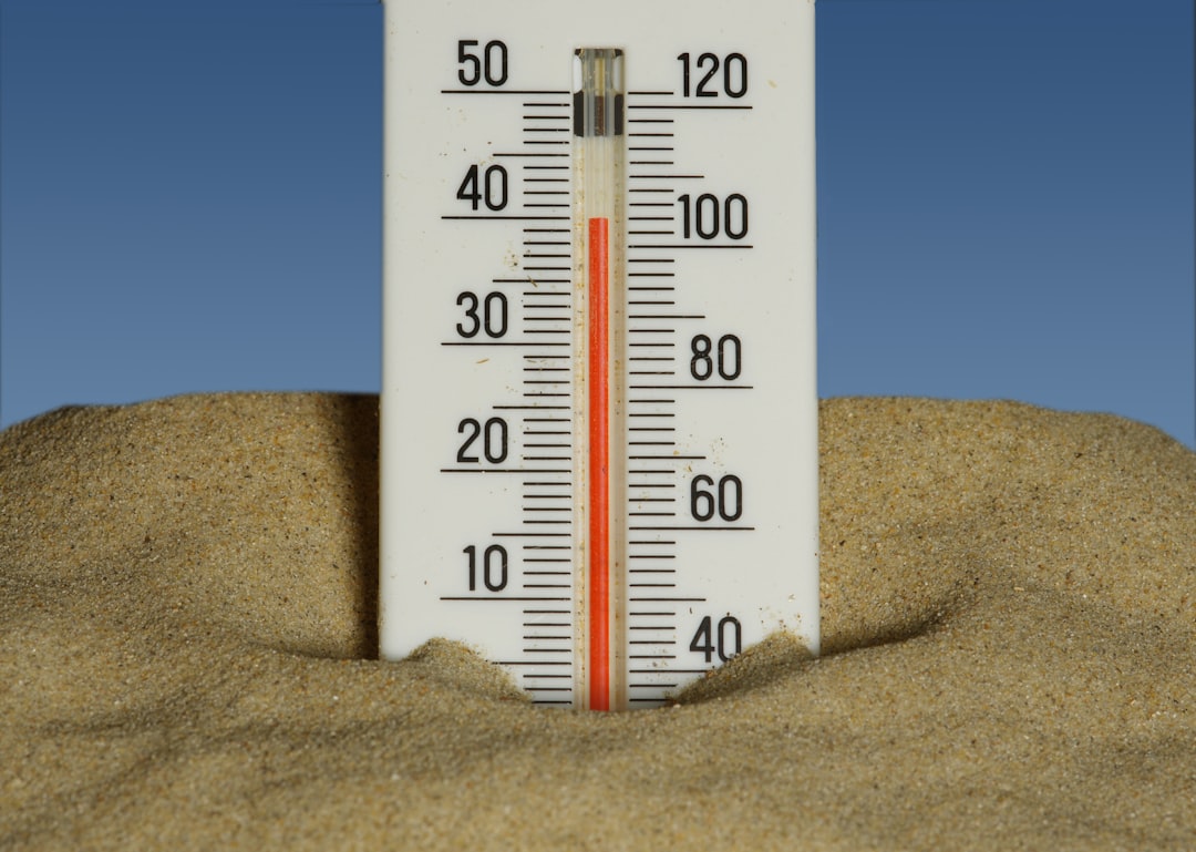 thermometer showing rising temperatures - Pre-summer AC tune-up