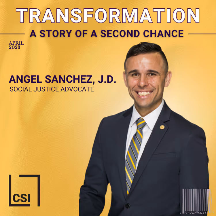 A man wearing a suit and tie smiles for a photo.