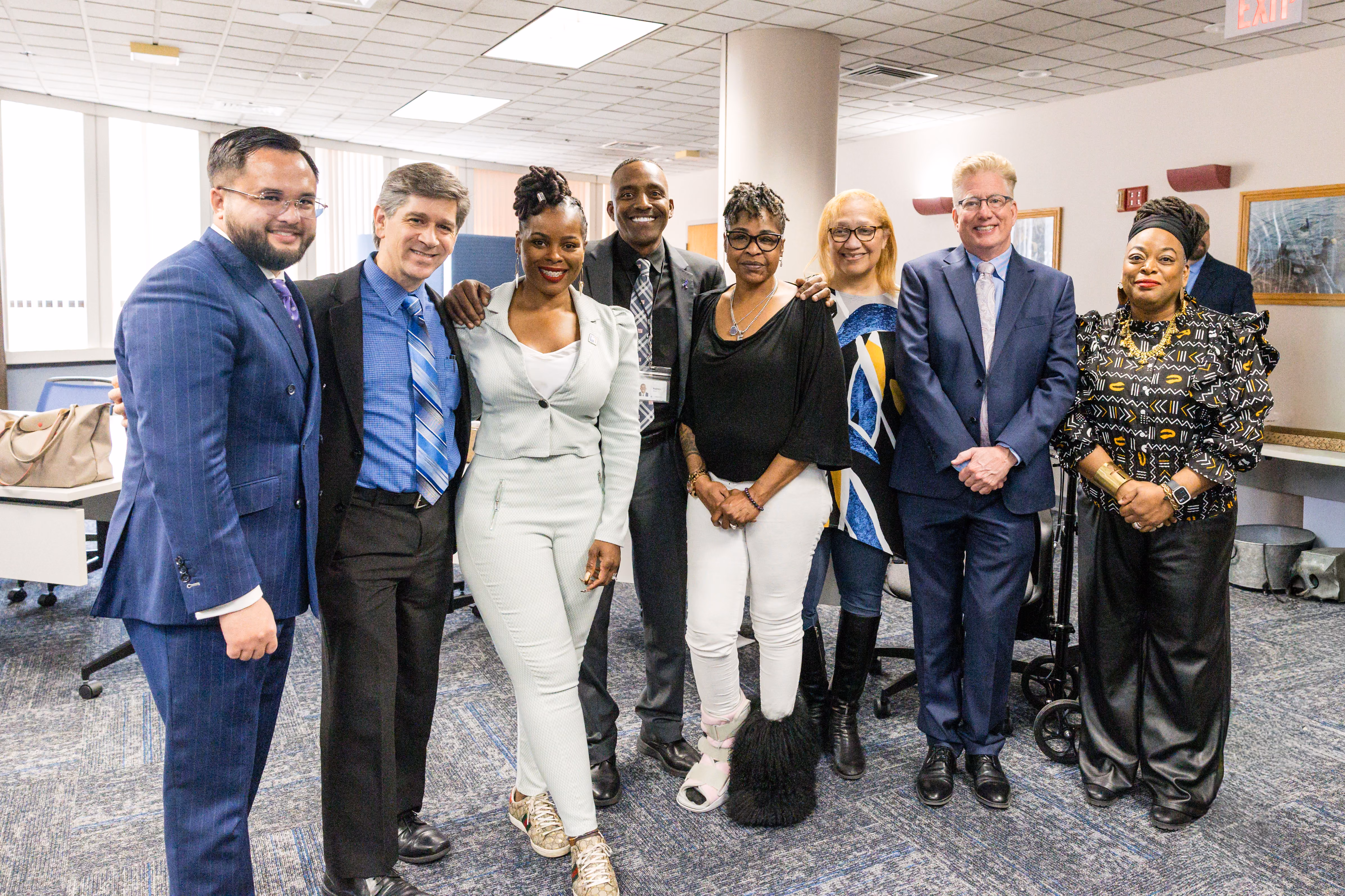 A diverse group of advocates poses together during the Connecticut Clean Slate press conference celebrating the state's implementation success.