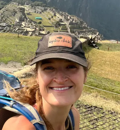 Woman taking a selfie with Machu Picchu in the background