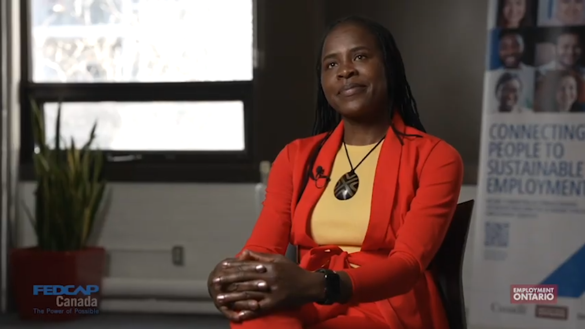 Woman sitting in a chair being interviewed (Thumbnail for youtube video)