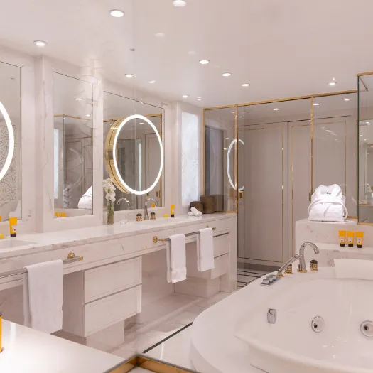 Espace bien-être raffiné avec baignoire et finitions élégantes à l’Hôtel du Collectionneur.