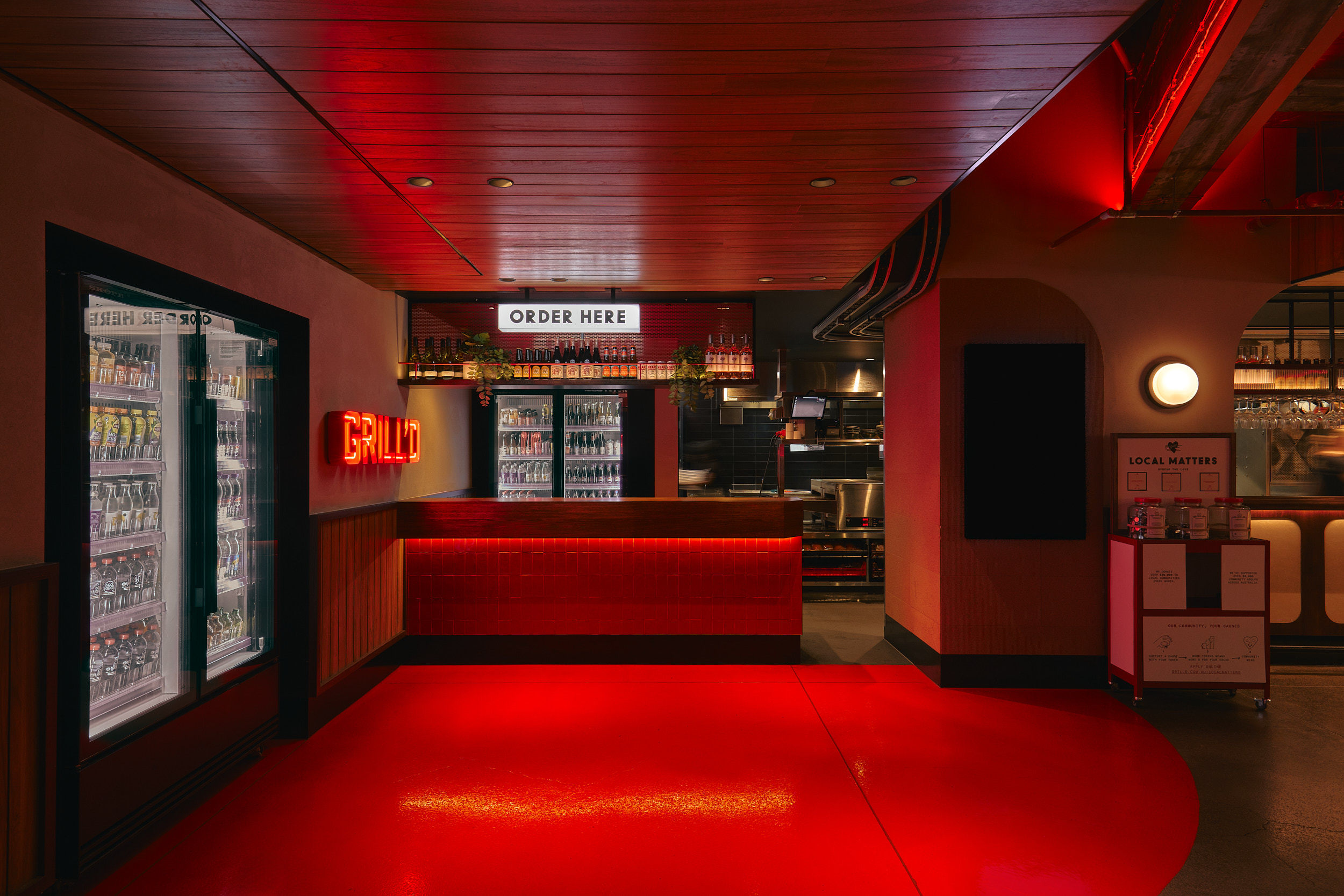 Order Here Sign Drink Fridge Red Painted Flooring Wall Light in Grilld. Photo by Michael Gazzola, Jake Roden.