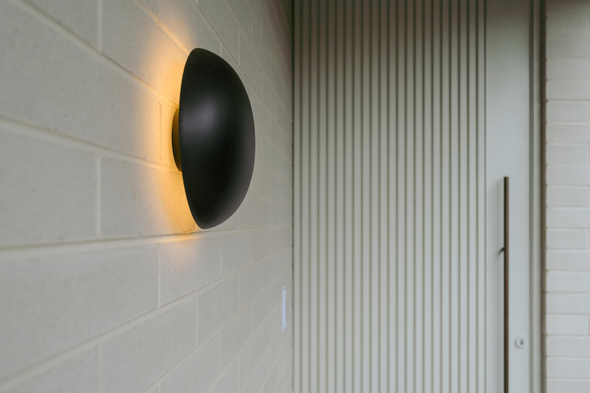 White Bricks Timber Door Round Wall Light in MC House.