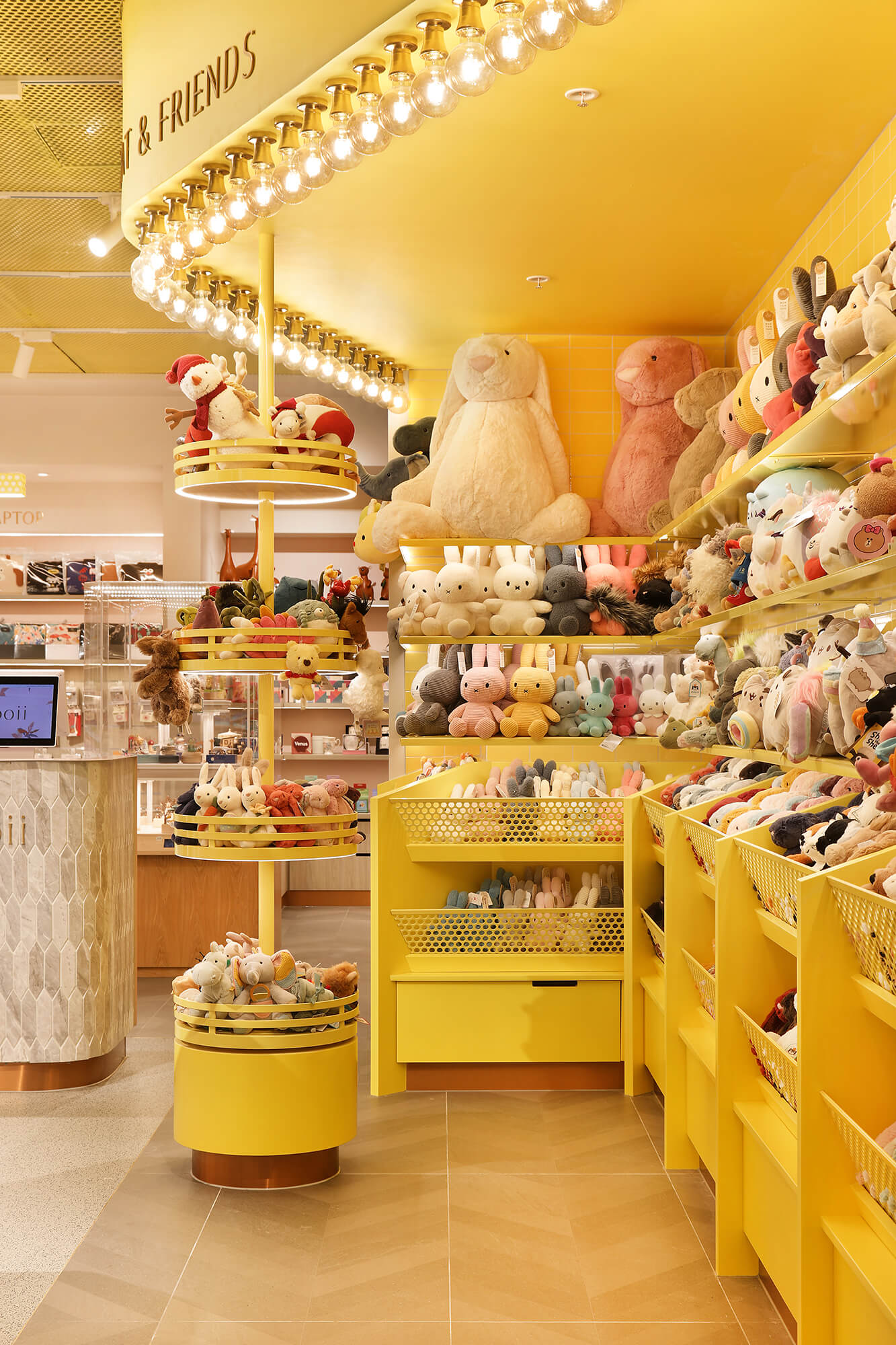 Light Bulbs Plushies Tiled Flooring Rabbits Plushies Toys Yellow Walls in Mooii. Photo by Michael Gazzola, Jake Roden.