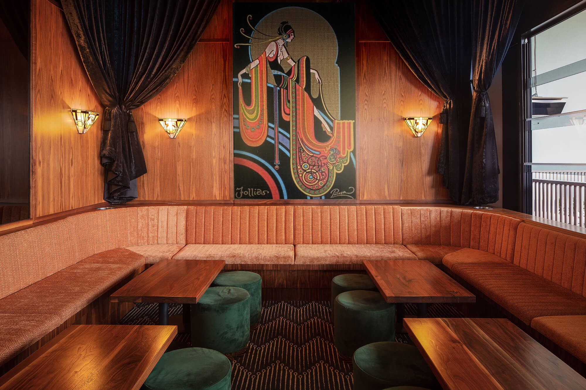 Art Deco Mural Velvet Drapes Terracotta Fluted Banquette Green Ottomans Walnut Tables Patterned Carpet Art Glass Sconces in Nick & Nora’s. Photo by Ryan Sauer.