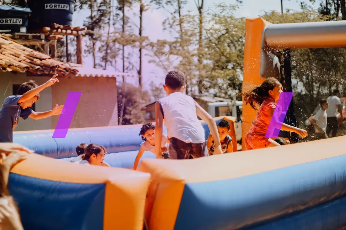 Comer image for the article: How Much Does It Cost to Start a Bounce House Rental Business: A Detailed Overview. The image shows kids jumping in an inflatable bouncy castle.