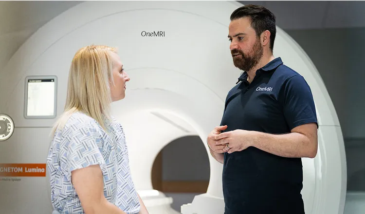 Consultation between patient and MRI technician in clinic

